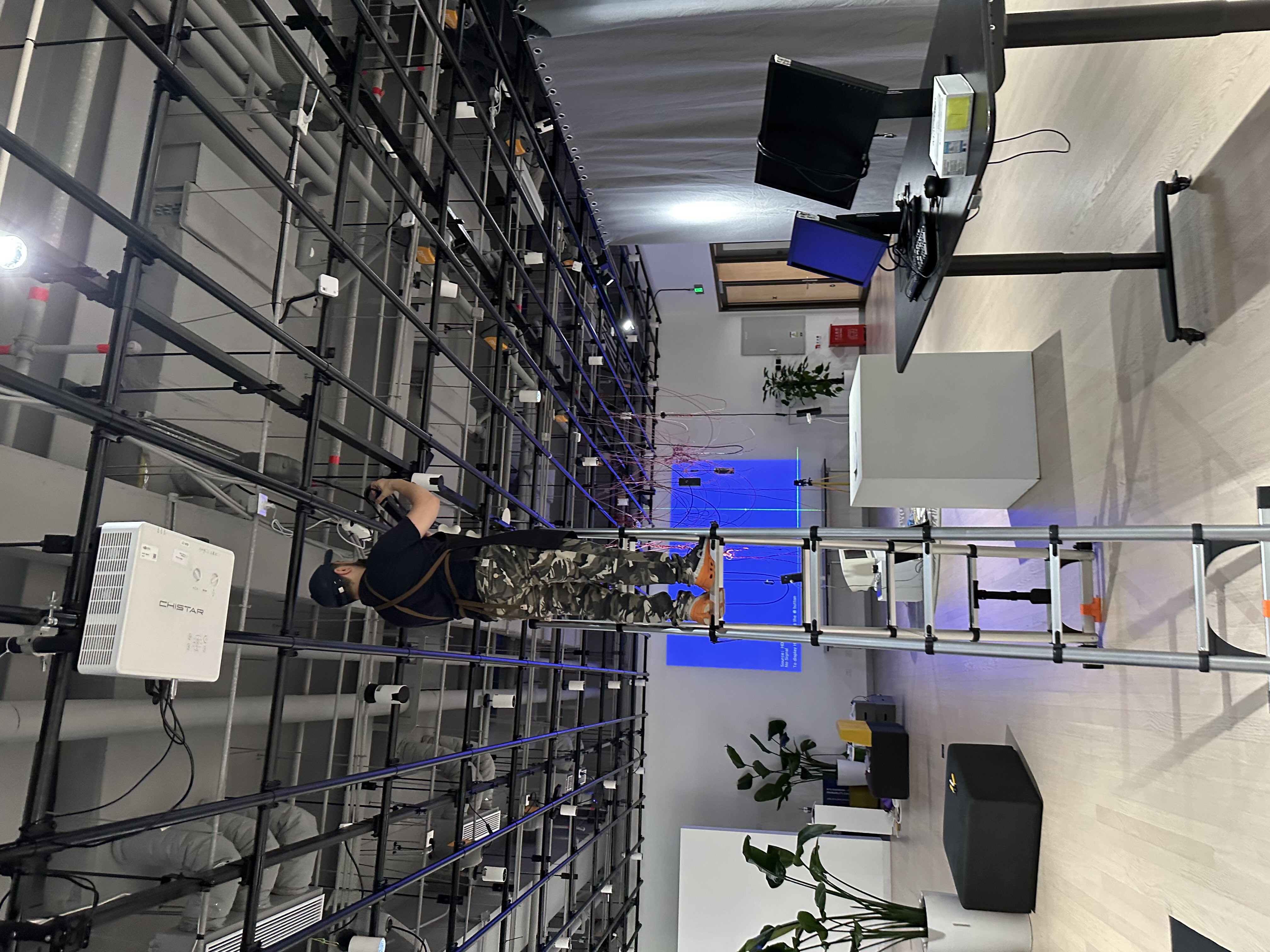 Professor Didakis adjusts the lights near my setup