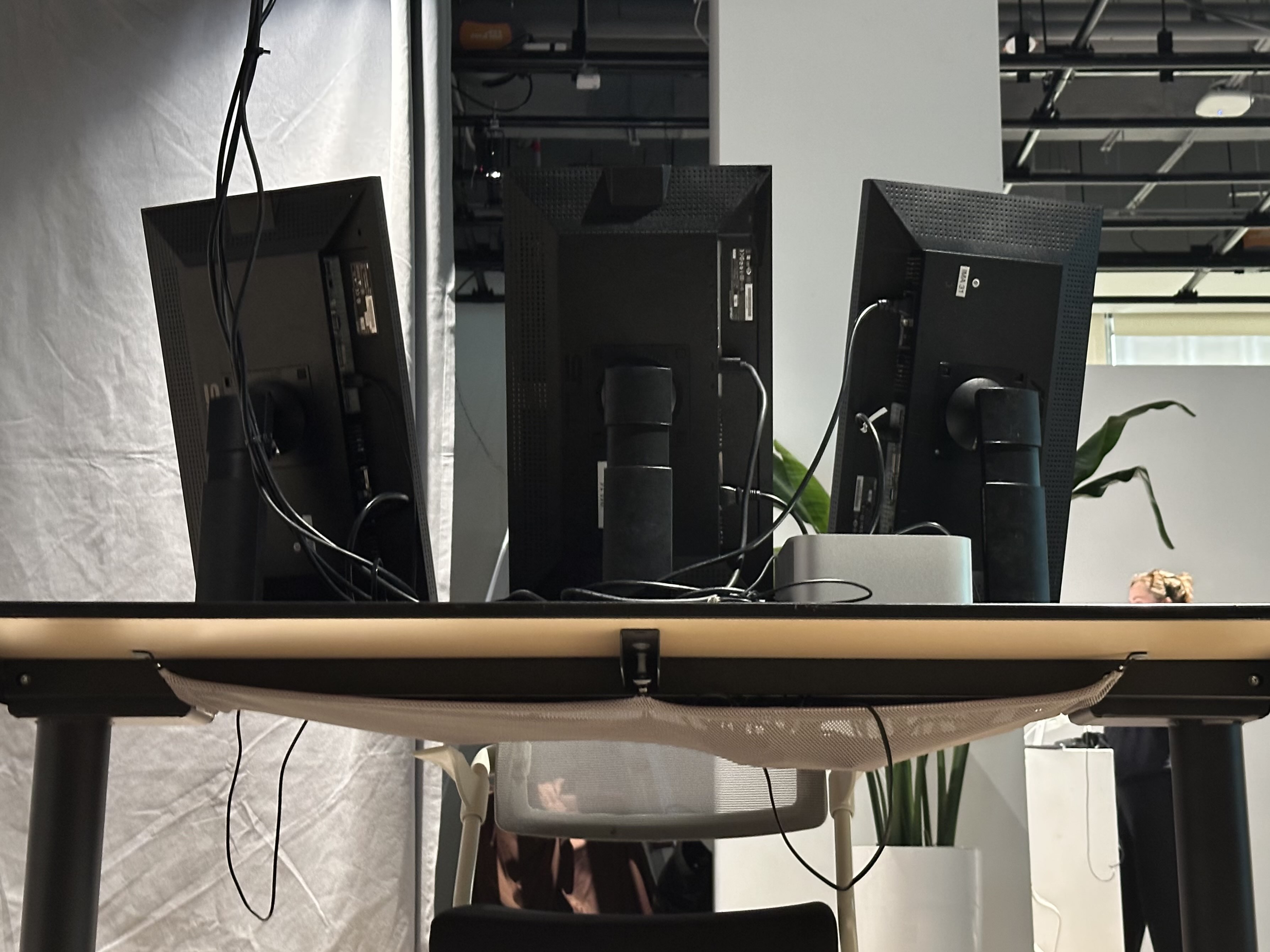 Back view of chair and desk with monitors
